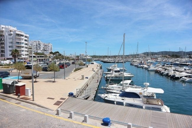 Coastal Promenade Along Cala Portinatx Beach With Azure Blue